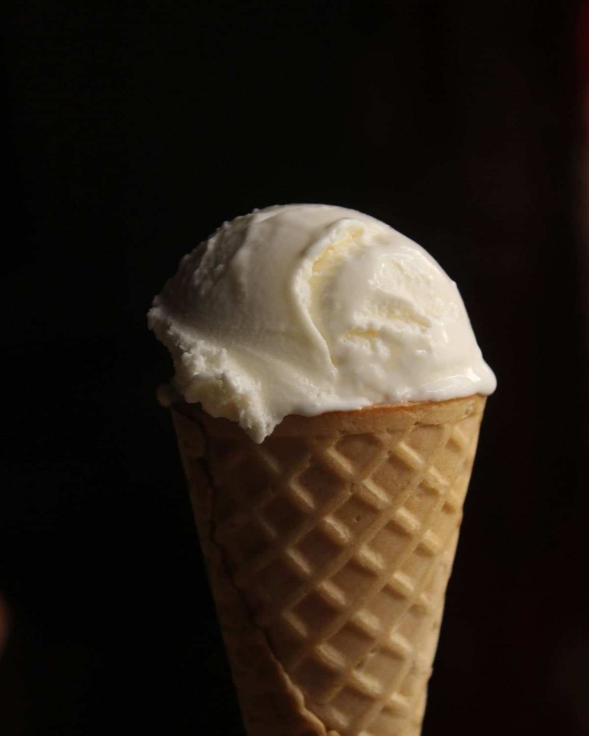 Vanilla ice cream in a waffle cone