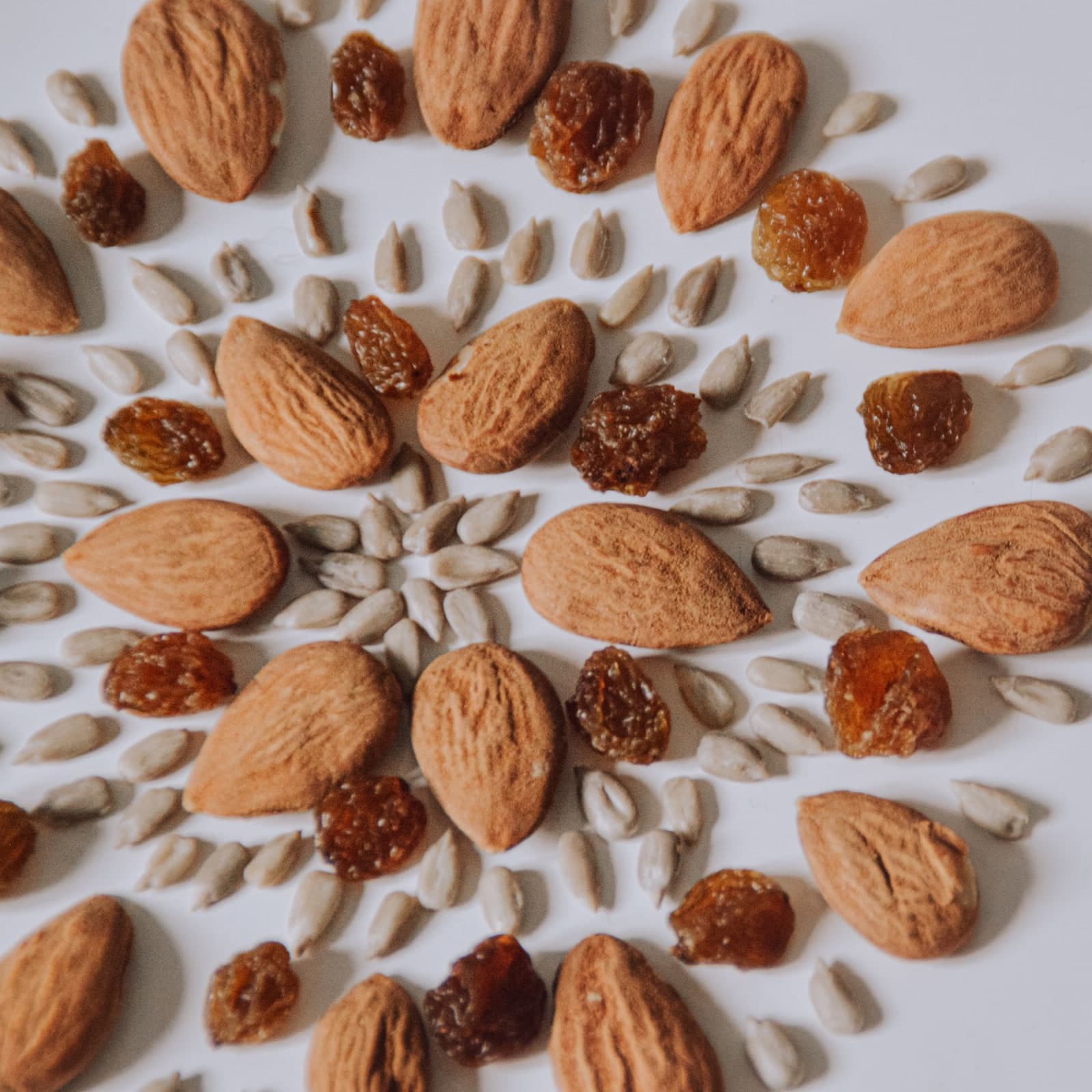 Almonds, seeds and raisins arranged in a spiral